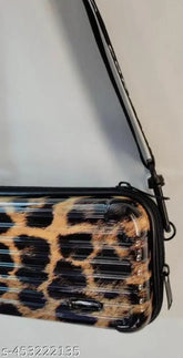 Solid PVC Forever Young sling bag, mini suitcase crossbody for women and girls. RFID protected, waterproof case, detachable strap" (108 characters)